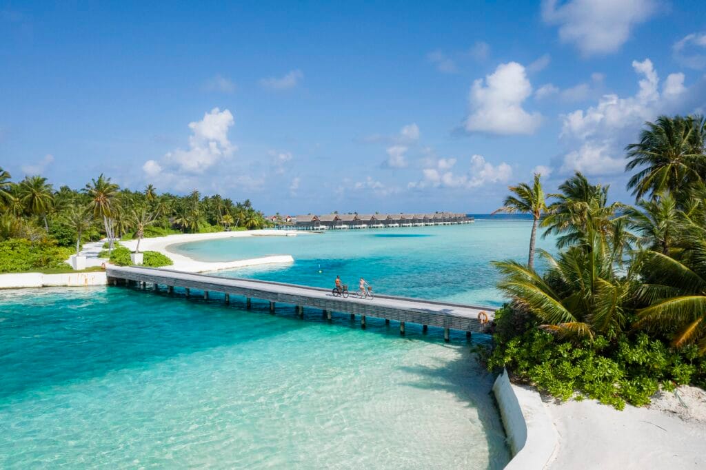 niyama private islands bridge with couple cycling