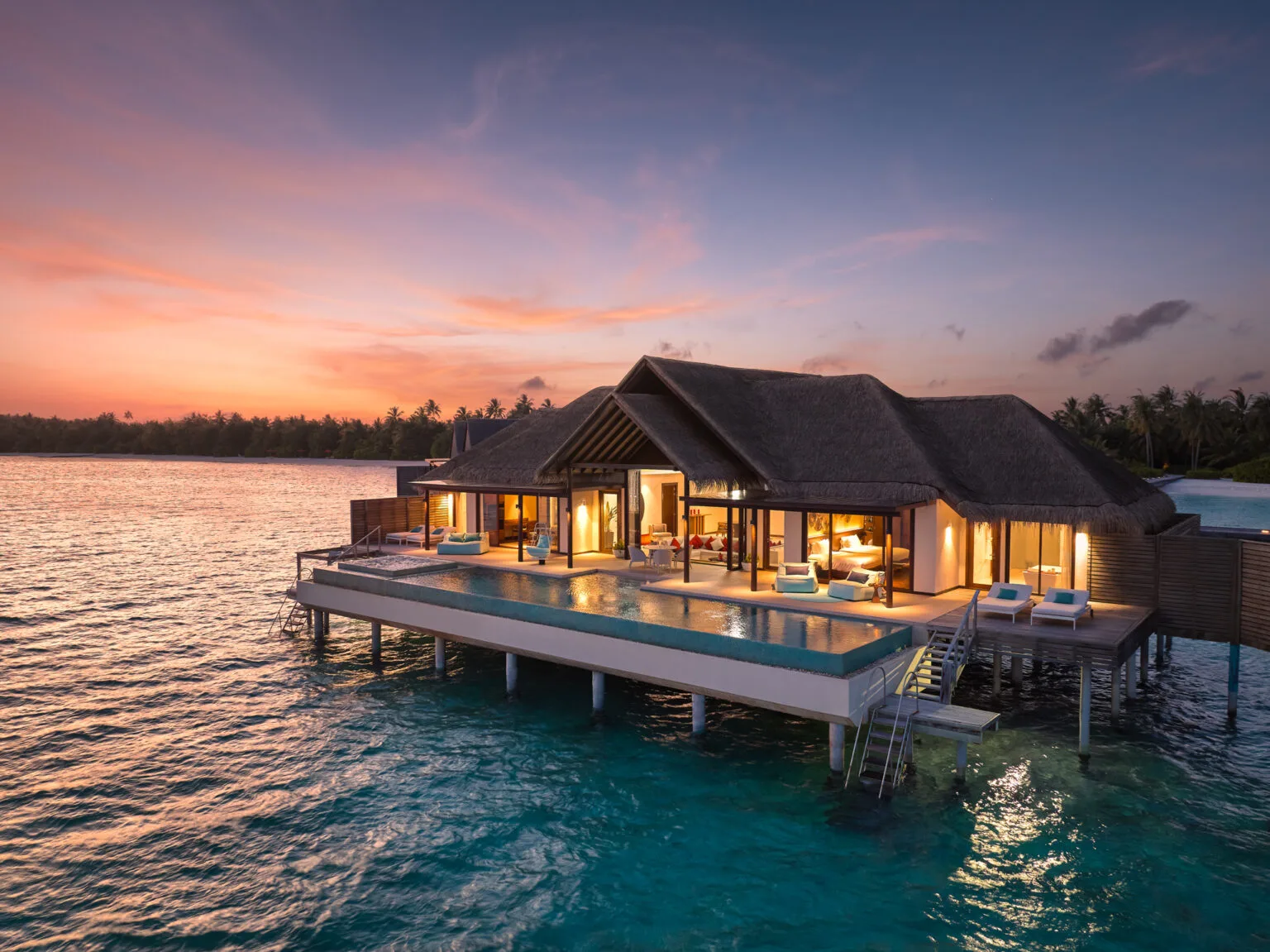 niyama private islands two bedroom ocean pool pavilion by sunset 2