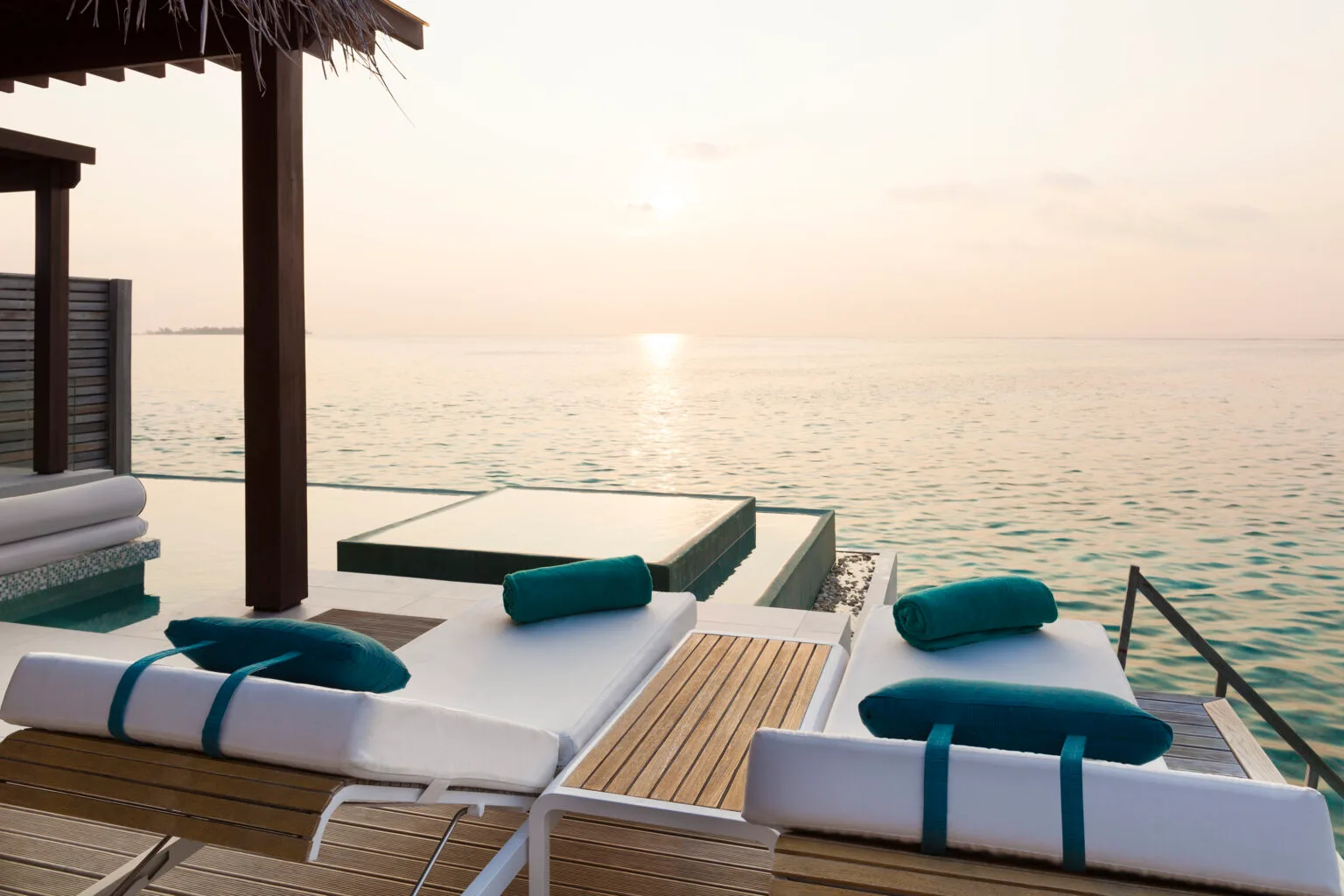 niyama private islands maldives deluxe overwater pool villa sunrise