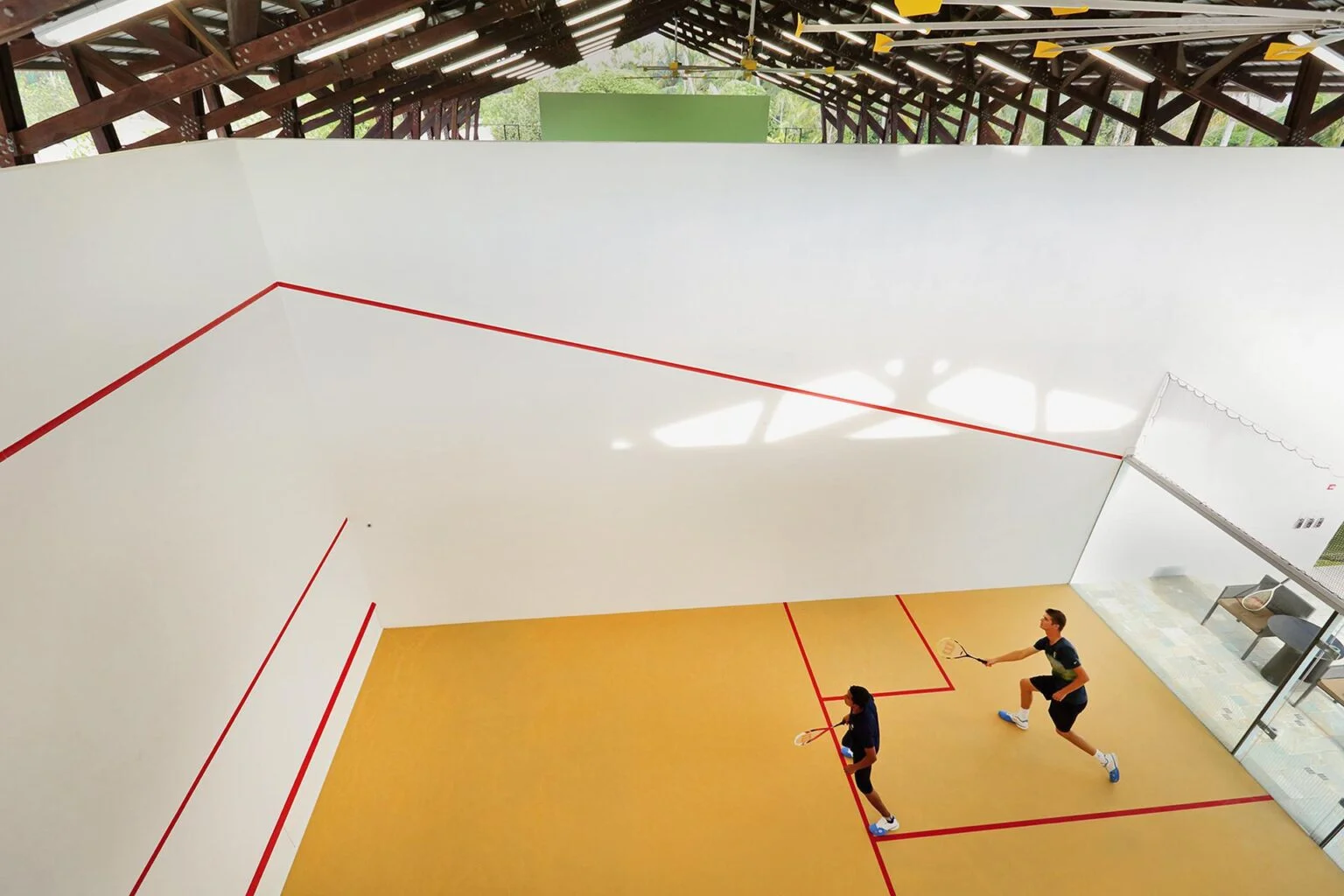 two people playing squash