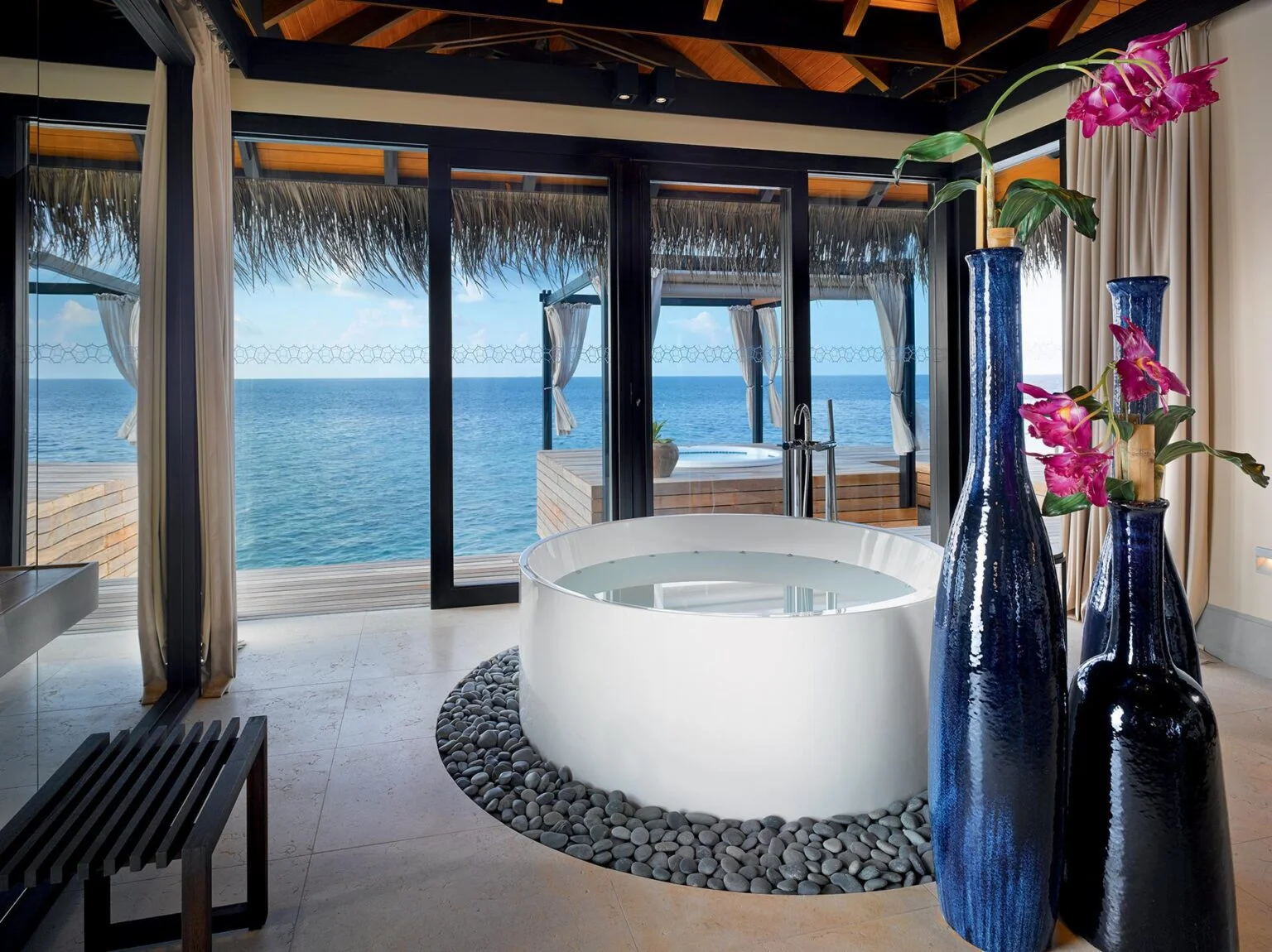 round white bathtub overlooking the sea