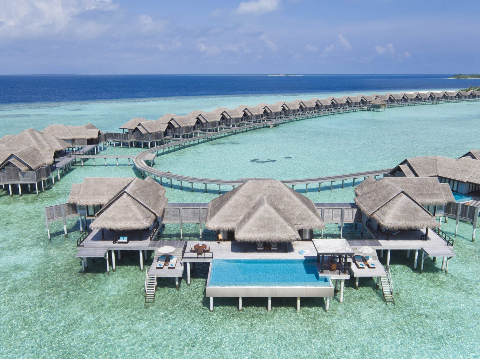 73163153-H1-AKIH_2Bed_OverWater__PoolResidence_Drone_G_A_H.jpg