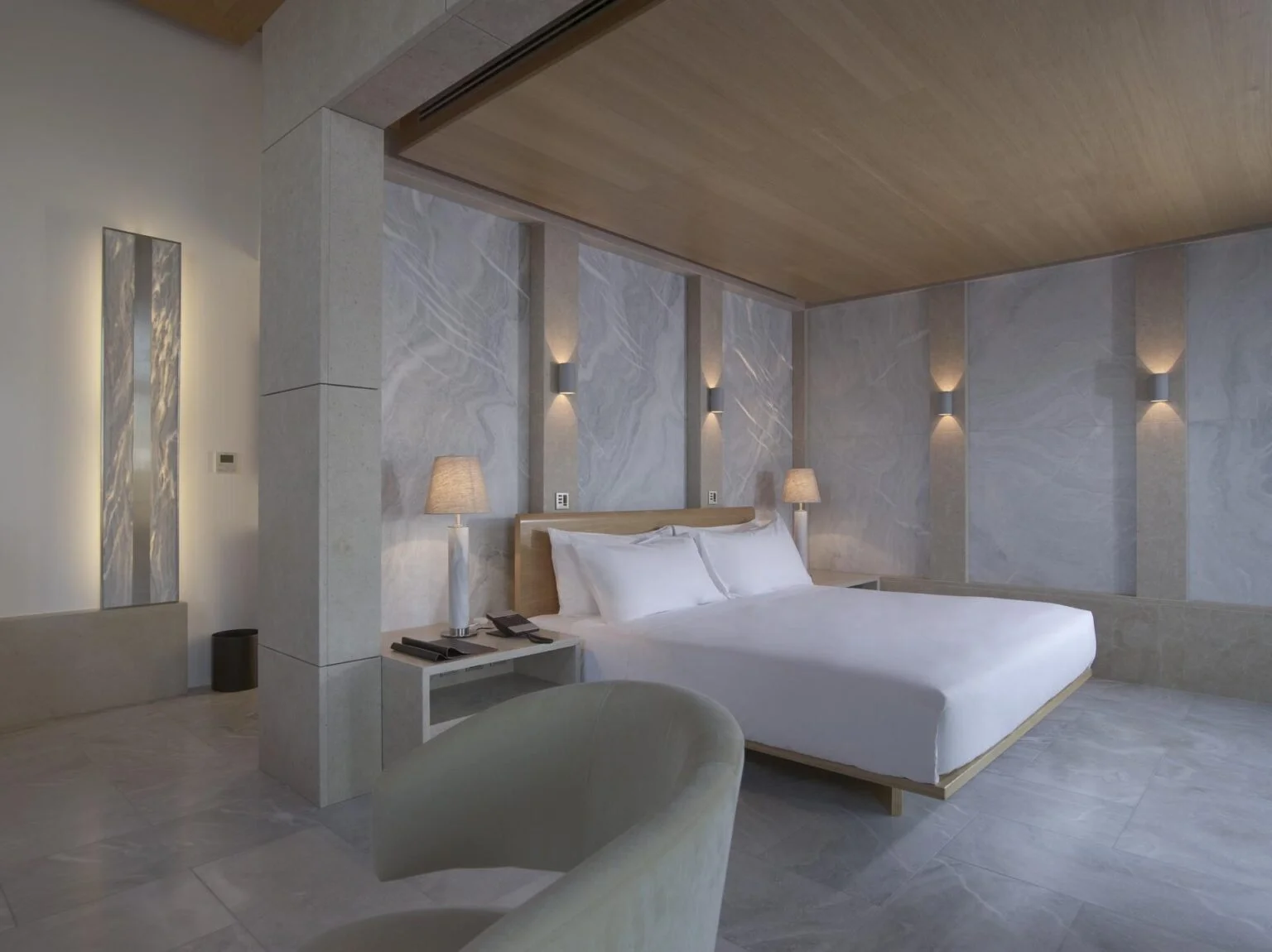bedroom with a large bed hotel Amanzoe