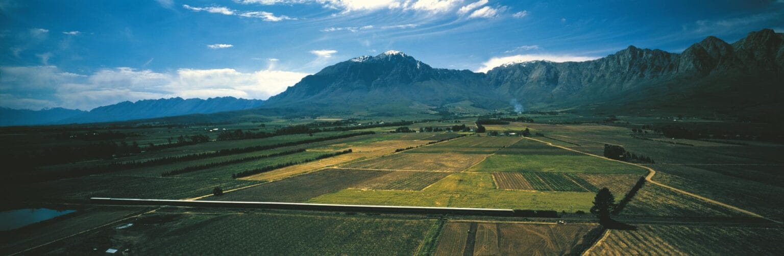 Train-Farm-lands-Mountains.jpg