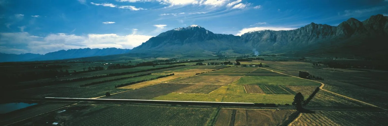 Train-Farm-lands-Mountains.jpg