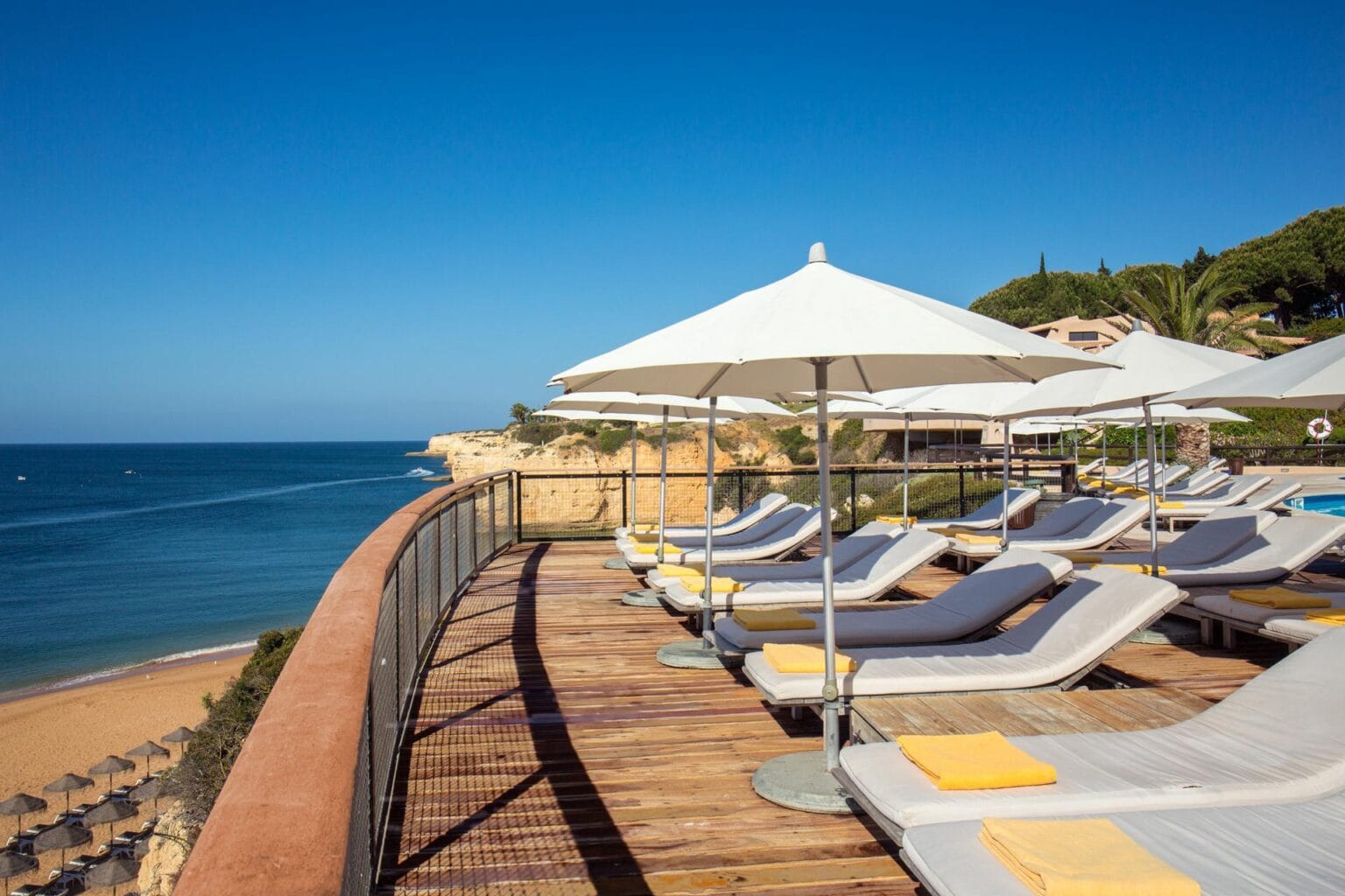 Vilalara-Thalassa-Resort-Pool-Deck-Over-Beach.jpg