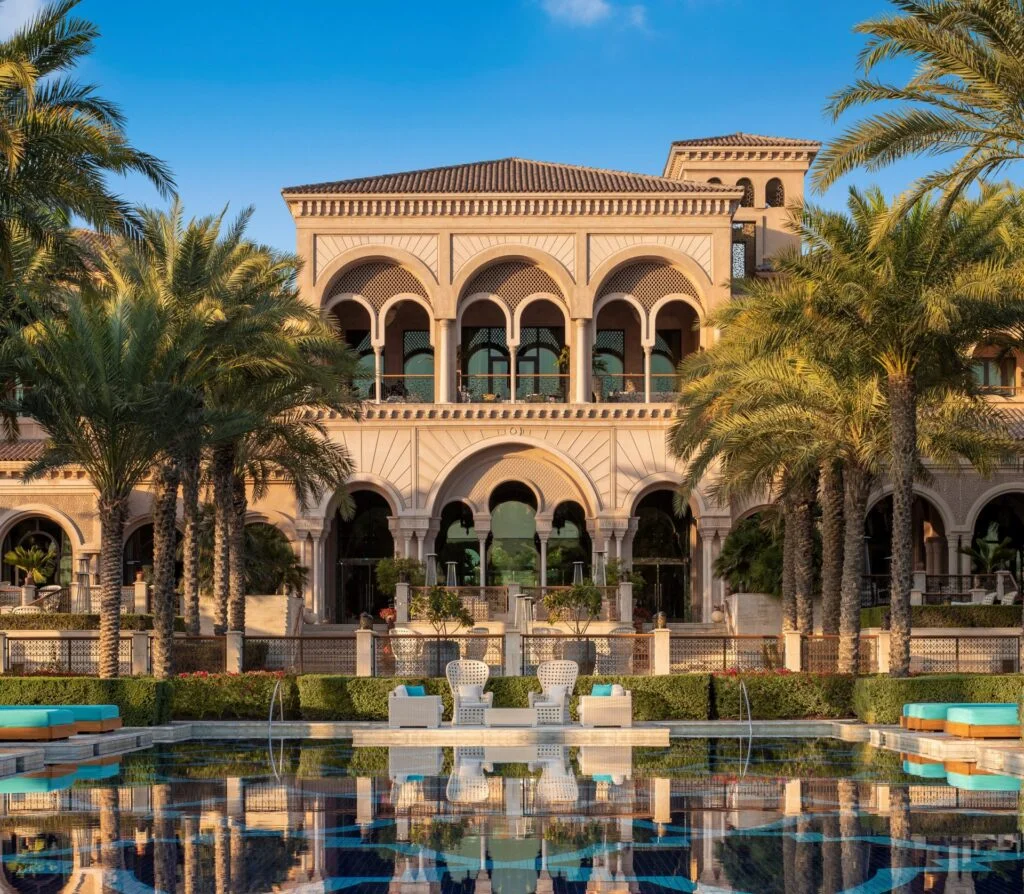 Villa Beachfront, One&Only The Palm exterior - rich vaulting, building surrounded by greenery, light shade of brick
