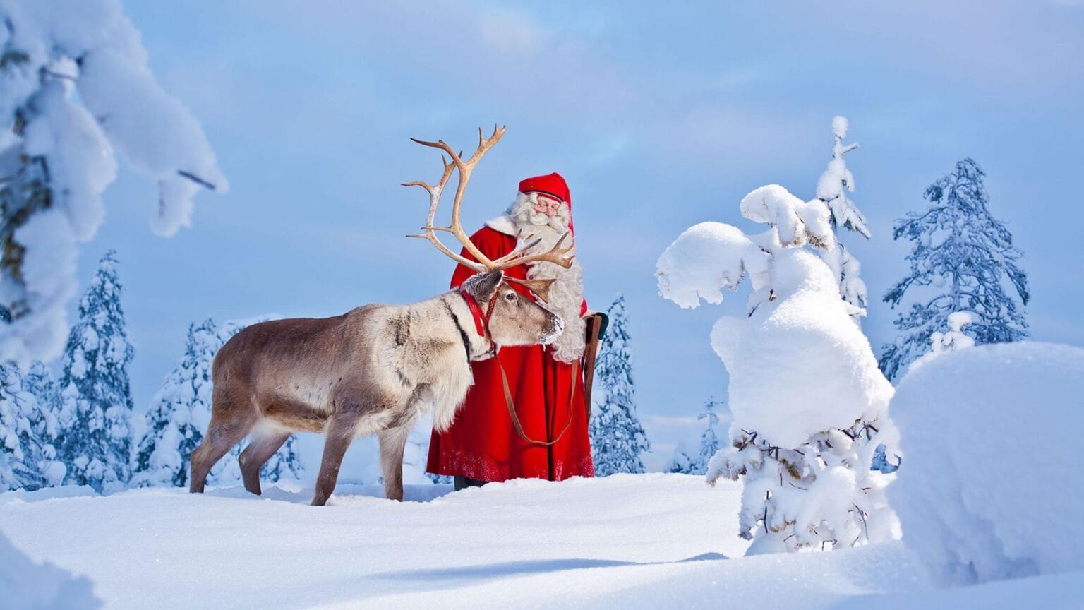 visit-rovaniemi-santa-claus-reindeer-snow-frontpage.jpg