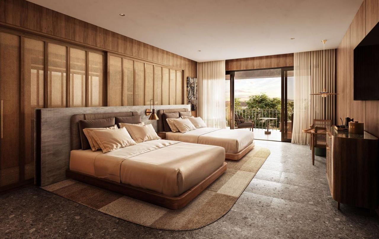 przykładowa sypialnia z dużym łóżkiem, w kolorach białych, beżowych i brązowych waldorf astoria costa rica punta cacique