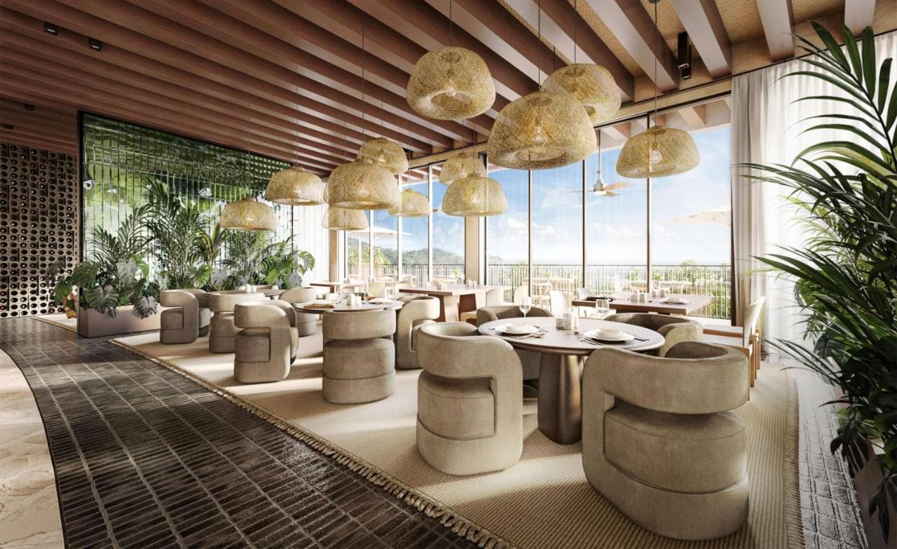 miejsce restauracji w waldorf astoria costa rica punta cacique - beżowe krzesła i jasny wystrój w nowoczesnym stylu z widokiem na przyrodę