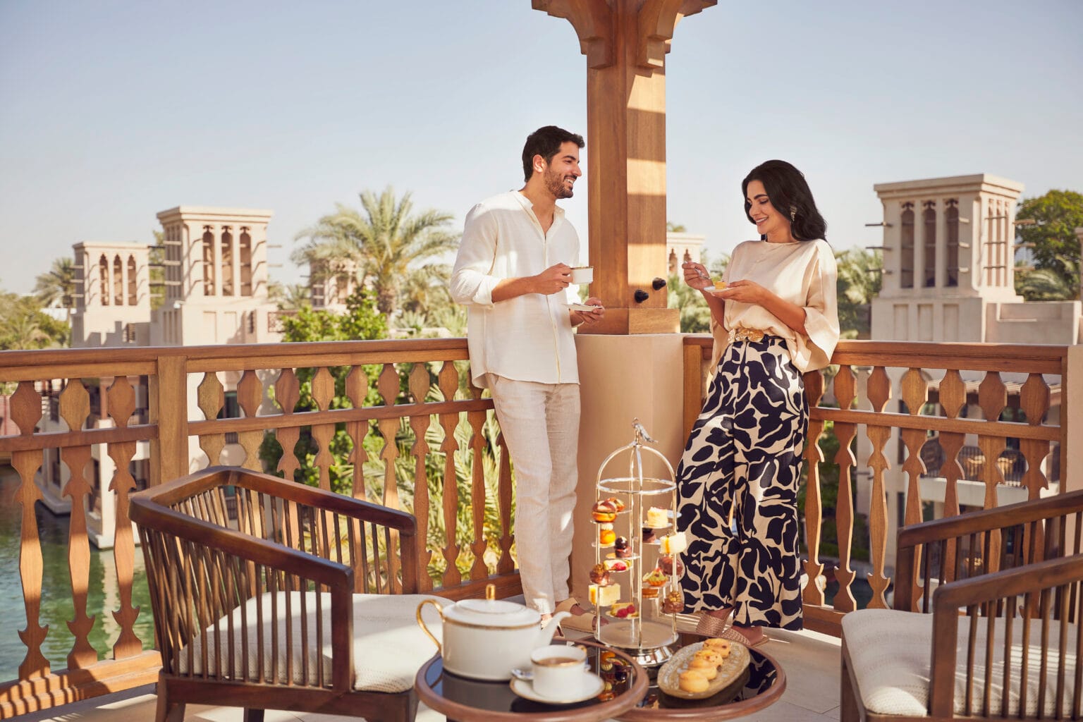 malakiya villas lifestyle couple afternoon tea on the balcony