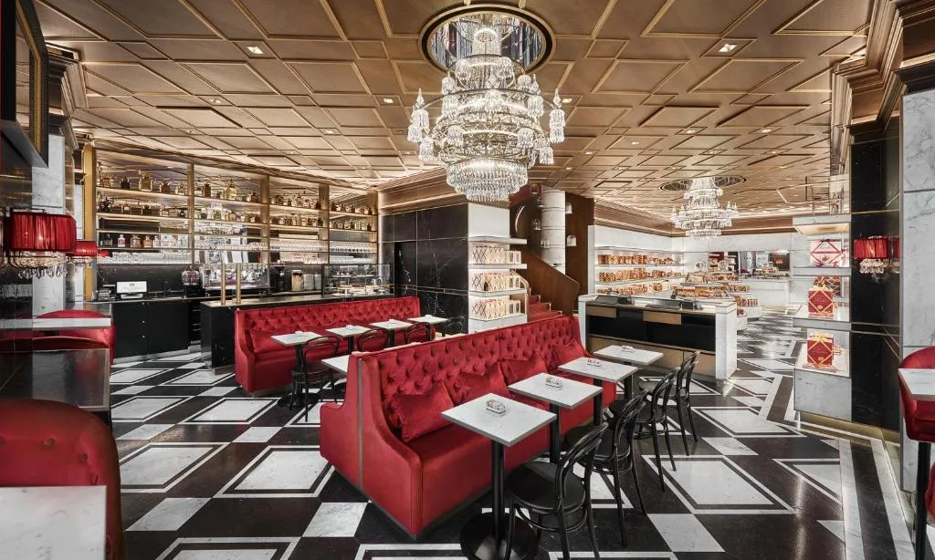Hotel Sacher Wien restaurant with red sofas, checkerboard floor