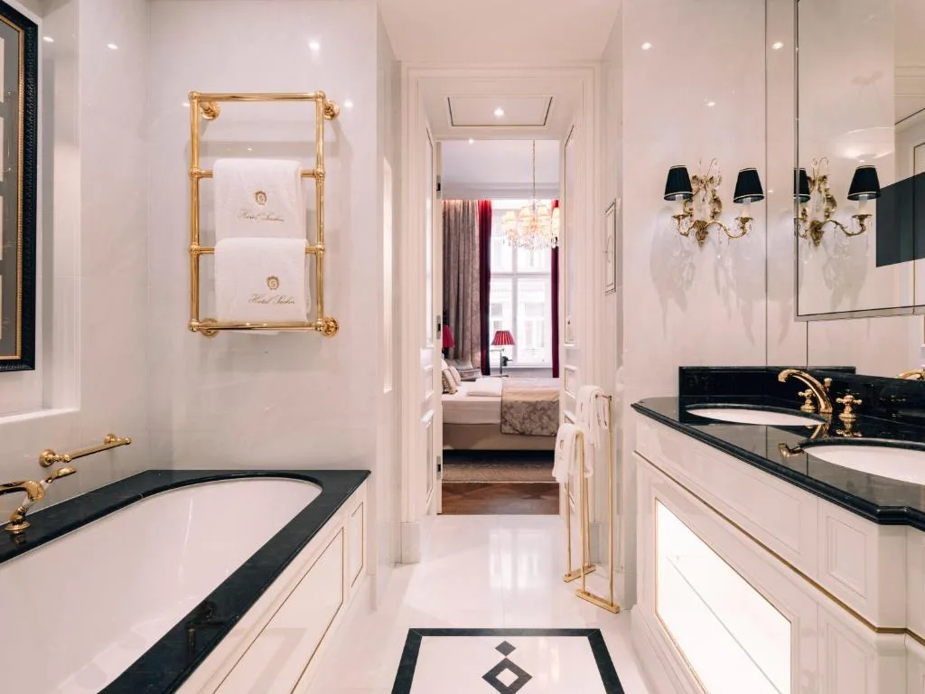 hotel sacher wien bathroom with bathtub, white interior with black accents