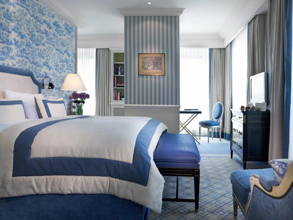 hotel sacher wien bedroom with living room in blue colors